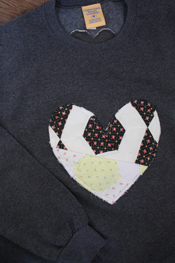 one of a kind quilted heart sewn on charcoal sweaters, unisex and oversized fit, hand cut and sewn in canada