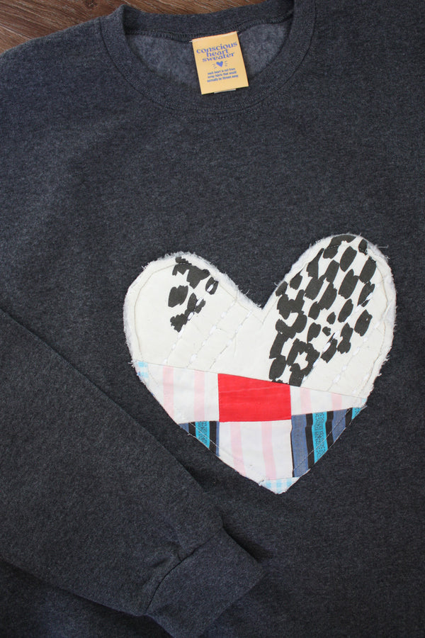 one of a kind quilted heart sewn on charcoal sweaters, unisex and oversized fit, hand cut and sewn in canada