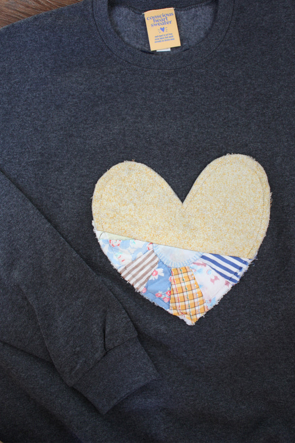 one of a kind quilted heart sewn on charcoal sweaters, unisex and oversized fit, hand cut and sewn in canada