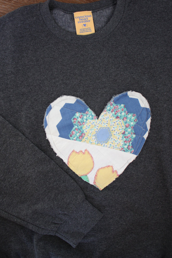 one of a kind quilted heart sewn on charcoal sweaters, unisex and oversized fit, hand cut and sewn in canada