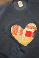 one of a kind quilted heart sewn on charcoal sweaters, unisex and oversized fit, hand cut and sewn in canada