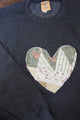 one of a kind quilted heart sewn on charcoal sweaters, unisex and oversized fit, hand cut and sewn in canada