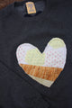 one of a kind quilted heart stitched on a charcoal sweater, unisex and oversized fit, hand cut and sewn in canada