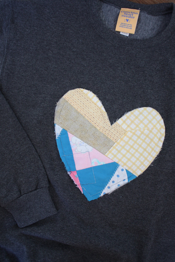 one of a kind quilted heart stitched on charcoal sweater, unisex and oversized fit, hand cut and sewn in canada