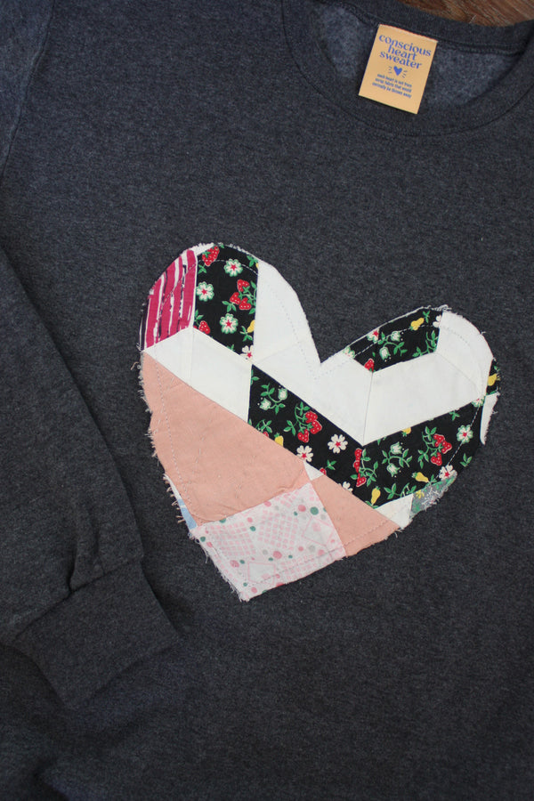 one of a kind quilted heart stitched on charcoal sweater, unisex and oversized fit, hand cut and sewn in canada