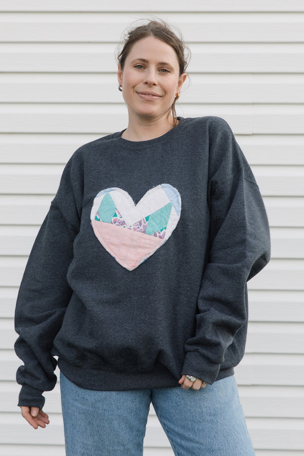 one of a kind quilted heart sewn on charcoal sweater, unisex and oversized fit, hand cut and sewn in canada