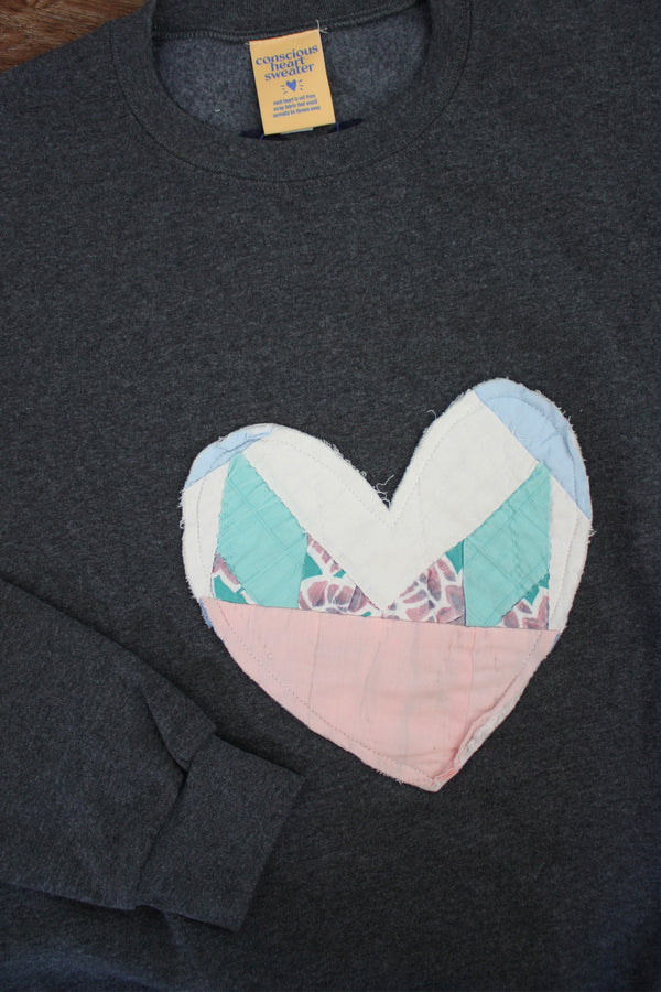 one of a kind quilted heart sewn on charcoal sweater, unisex and oversized fit, hand cut and sewn in canada