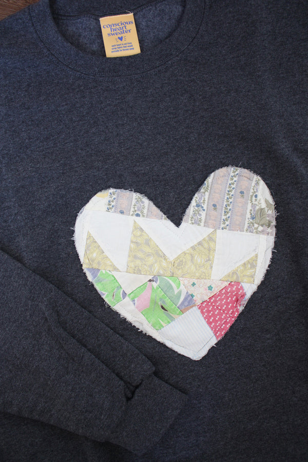 one of a kind quilted heart sewn on charcoal sweater, unisex and oversized fit, hand cut and sewn in canada