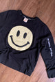 yellow smiley face on dark grey sweater, repurposed secondhand clothing, upcycled fashion