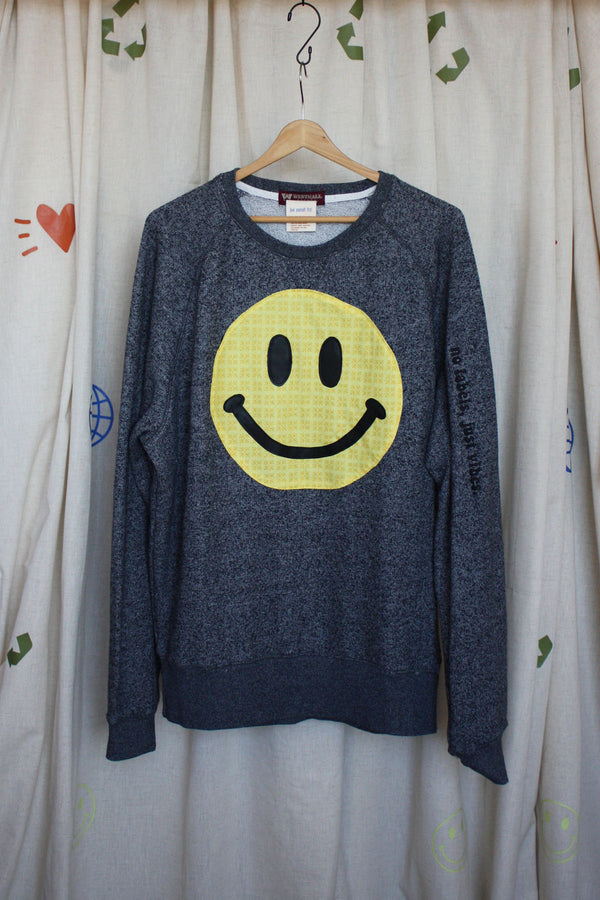 yellow smiley face on dark grey sweater, repurposed secondhand clothing, upcycled fashion