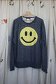 yellow smiley face on dark grey sweater, repurposed secondhand clothing, upcycled fashion