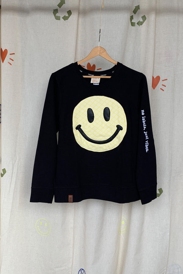 yellow smiley face on dark grey sweater, repurposed secondhand clothing, upcycled fashion