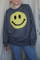 yellow smiley face on dark grey sweater, repurposed secondhand clothing, upcycled fashion