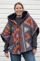 brown, blue and grey quilt upcycled into a poncho featuring fashionable hood, oversized fit and convenient pockets. made in canada