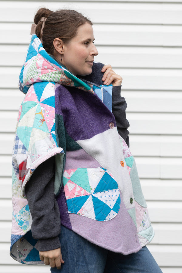 pastel coloured Clare Poncho, featuring a huge hood, pockets and oversized fit. upcycled and made in Canada