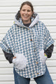 upcycled poncho made from blue and white quilt featuring an oversized hood, ponchos and vintage buttons, made in canada