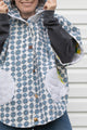 upcycled poncho made from blue and white quilt featuring an oversized hood, ponchos and vintage buttons, made in canada