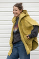 oversized poncho with hood and pockets, made with green chenille blanket upcycled and made in canada