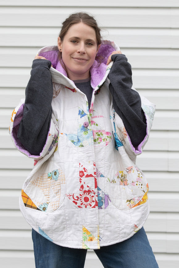 colourful pastel poncho, featuring a big hood, pockets and oversized style, upcycled from a stunning quilt and made in canada