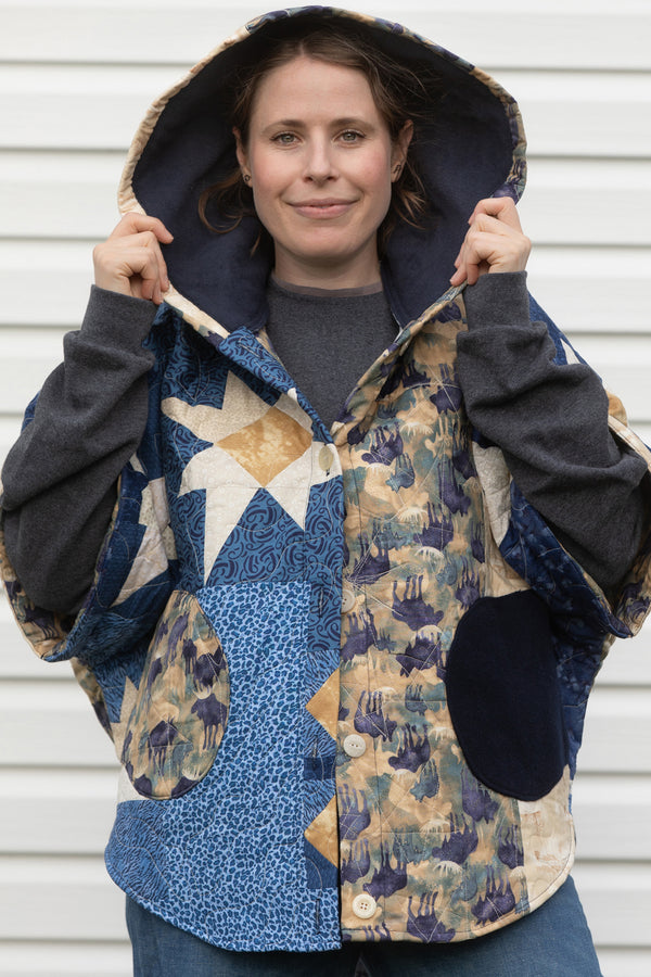 blue quilt repurposed into clare poncho, features oversized fit meant for layering, made in canada