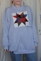 grey sweater with colourful quilt block on the front, repurposed secondhand sweater, upcycled clothing, made in canada