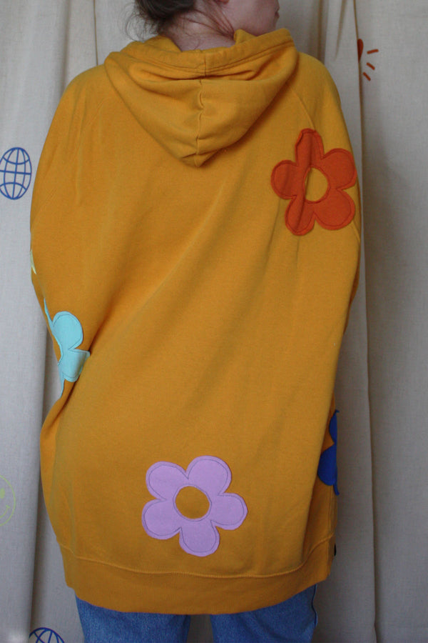 yellow upcycled hoodie with colourful flowers all over, repurposed in canada