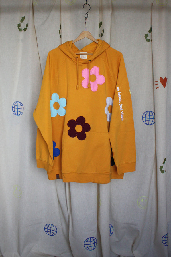 yellow upcycled hoodie with colourful flowers all over, repurposed in canada