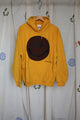 yellow upcycled sweater with brown smiley face, repurposed in canada